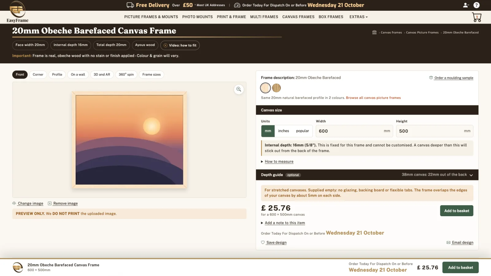 The sample sunset artwork shown in the natural wood frame.