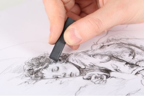 charcoal artist at work