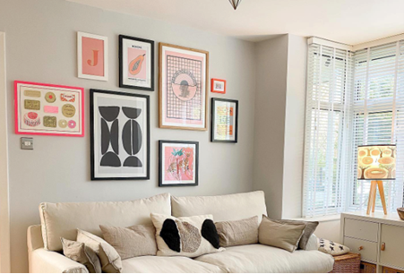 wall of framed pictures