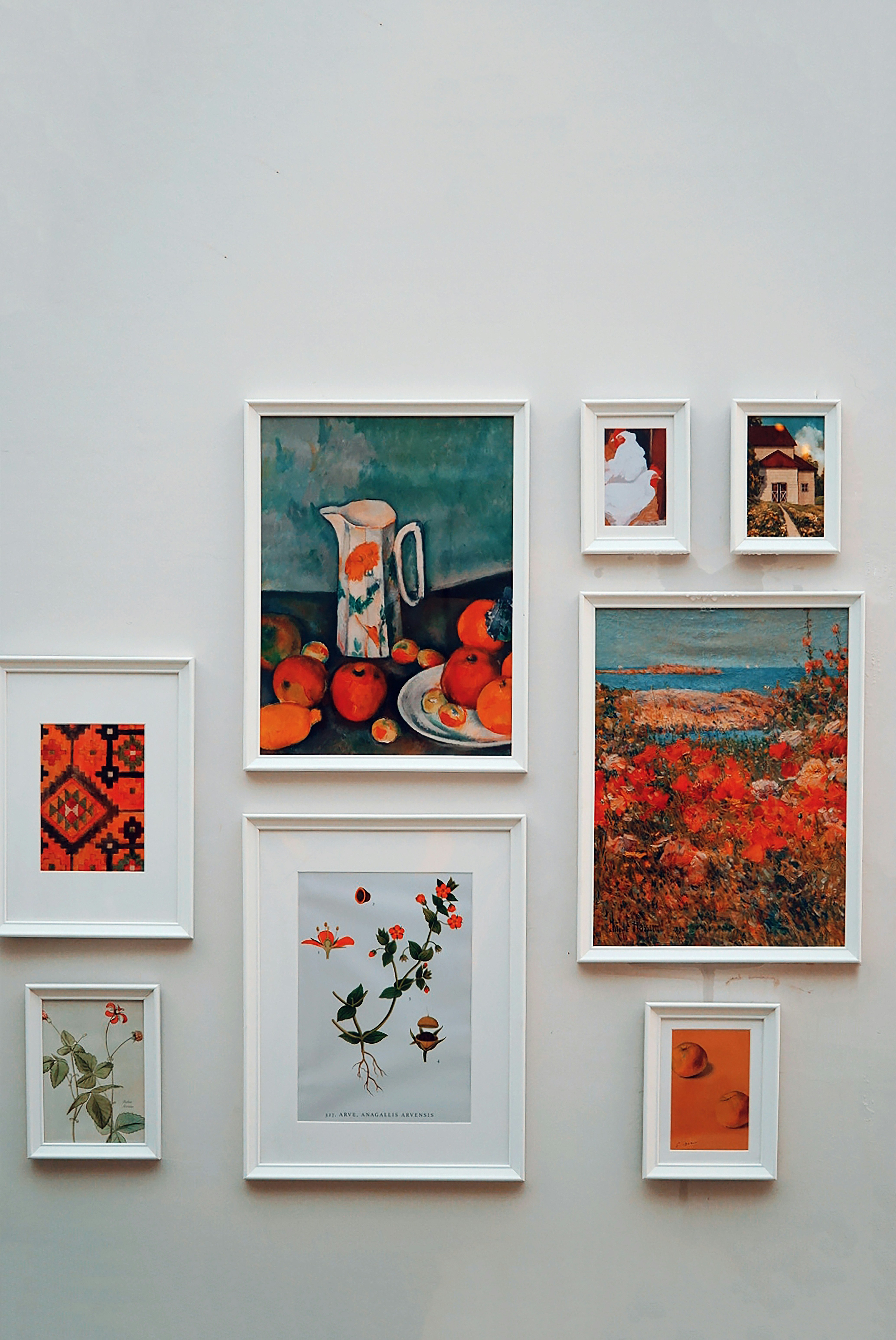 Children's abstract finger paintings clipped on a string line for casual display